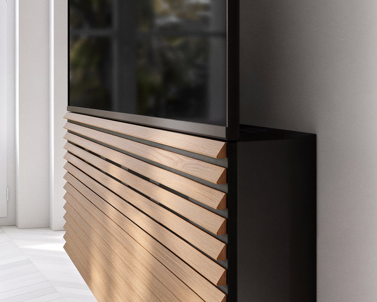 Side close-up of the FITUEYES ZEN TM65 Grille TV mount showing the TV position above the wood-slat panel