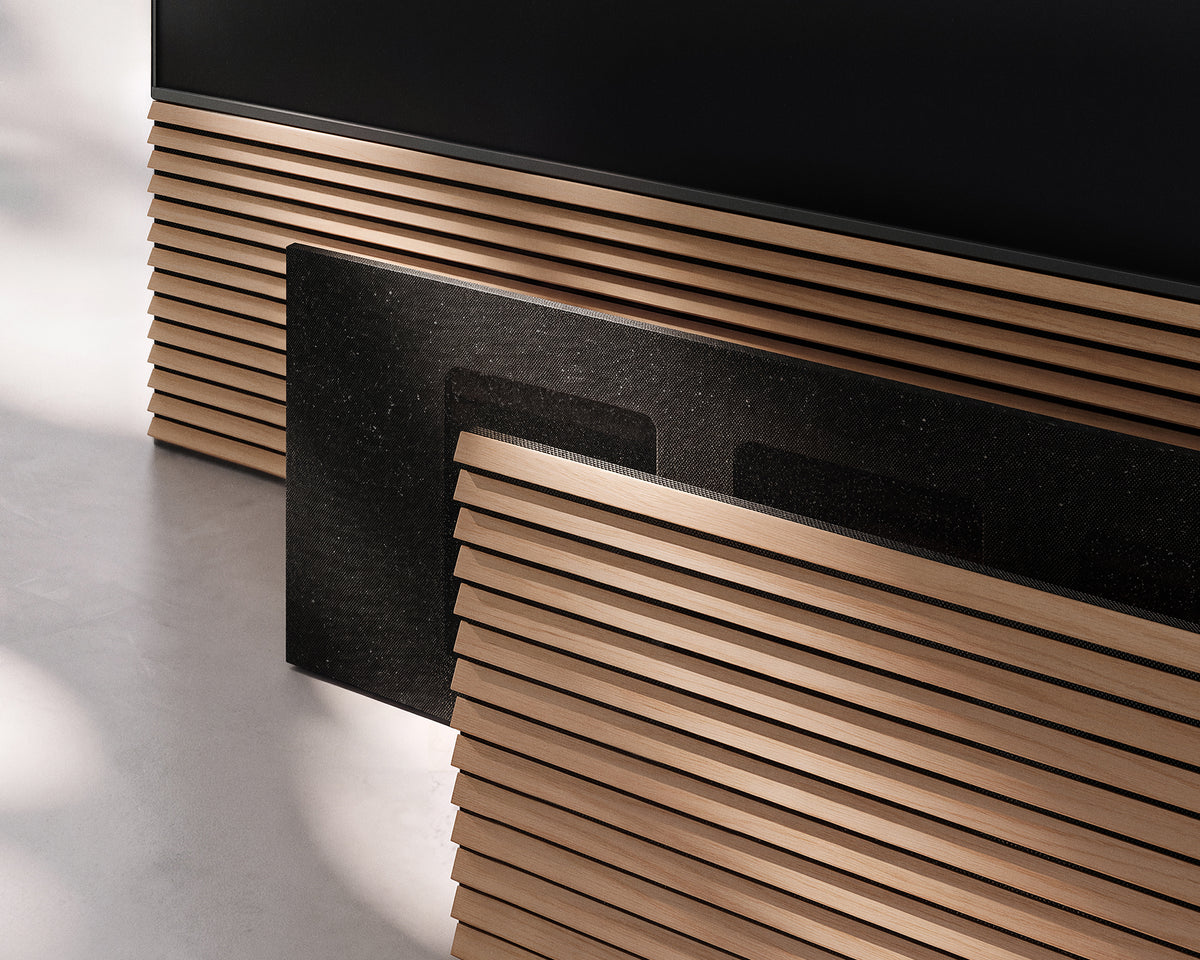 Wood-slat and black fabric front panels displayed together beneath a TV in the FITUEYES ZEN TM collection